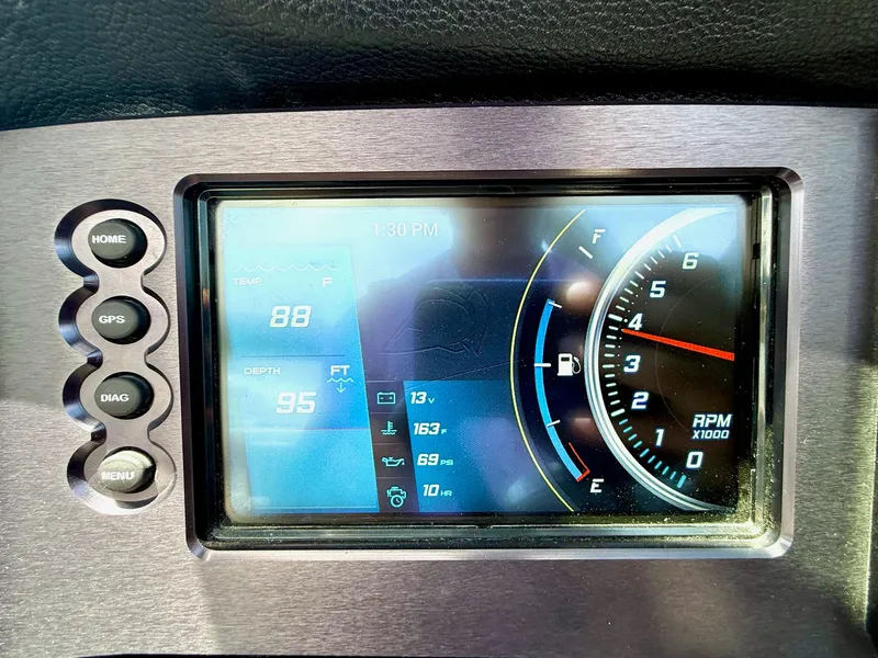 Slide: The Image of Dashboard display of a 2017 Centurion Ri237 boat showing temperature, depth, and RPM. - 13