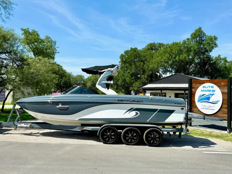 Slide: The Image of 2017 Centurion Ri237 boat on trailer at Elite Marine dealership. - 23