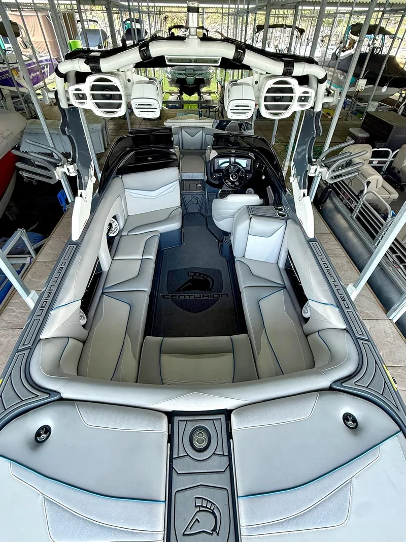 Slide: The Image of 2017 Centurion Ri237 boat interior with luxurious seating and advanced audio system. - 36