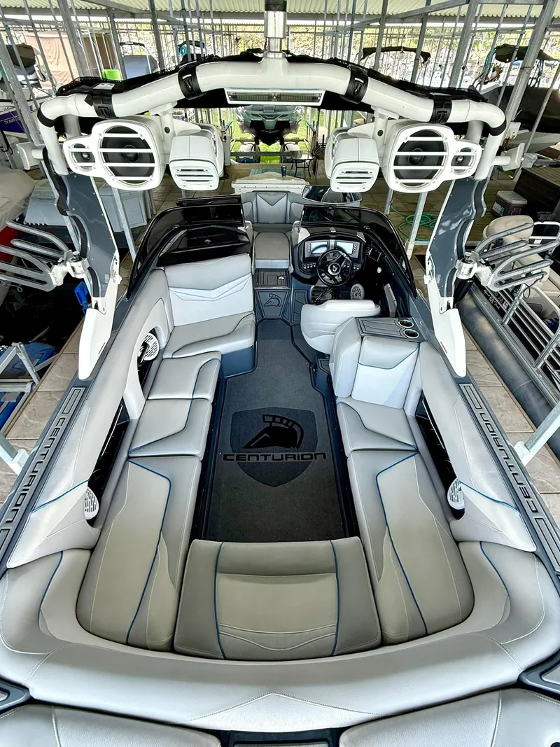 Slide: The Image of 2017 Centurion Ri237 boat interior with luxurious seating and advanced audio system. - 37