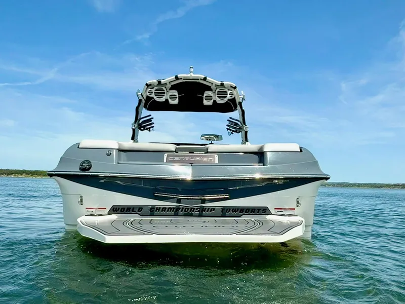 Slide: The Image of 2017 Centurion Ri237 boat on water, rear view, clear sky background. - 5