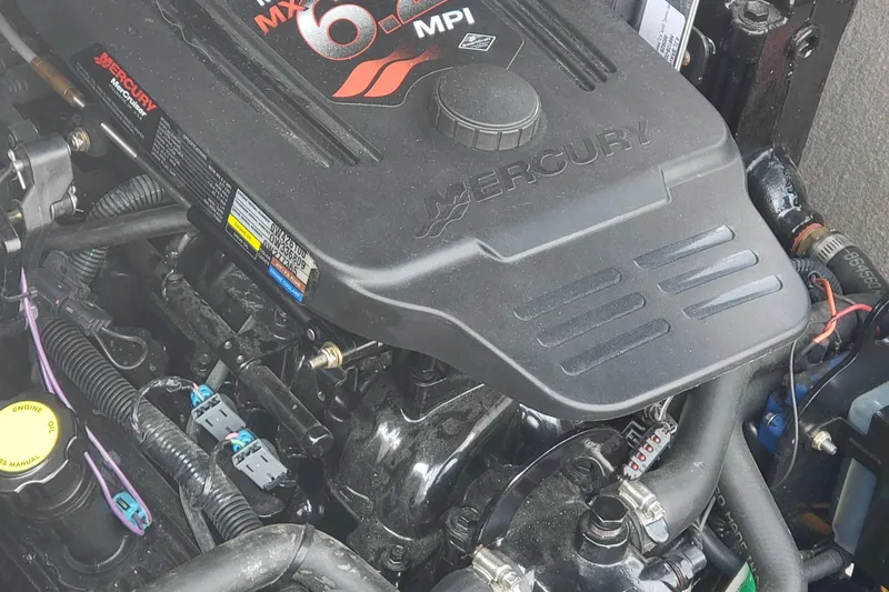 Slide: The Image of Engine of a 2006 Ebbtide 2300 BRL boat, featuring a Mercury MX 6.2 MPI. - 15
