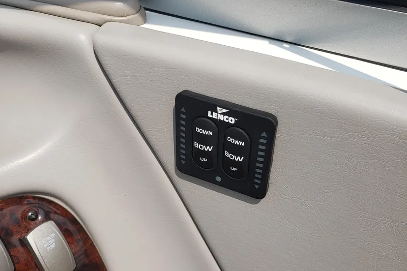 Slide: The Image of 2006 Ebbtide 2300 BRL boat with navy cover in storage. - 4