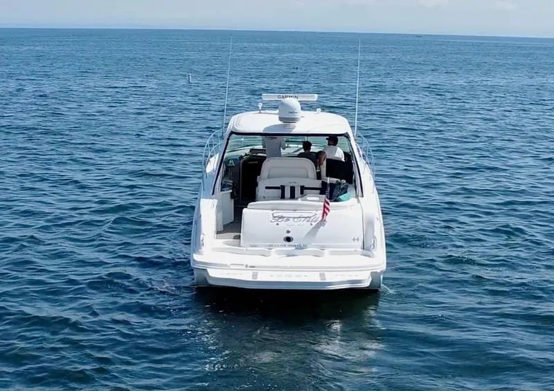 Slide: The Image of 2006 Sea Ray 44 Sundancer yacht cruising on open water. - 17