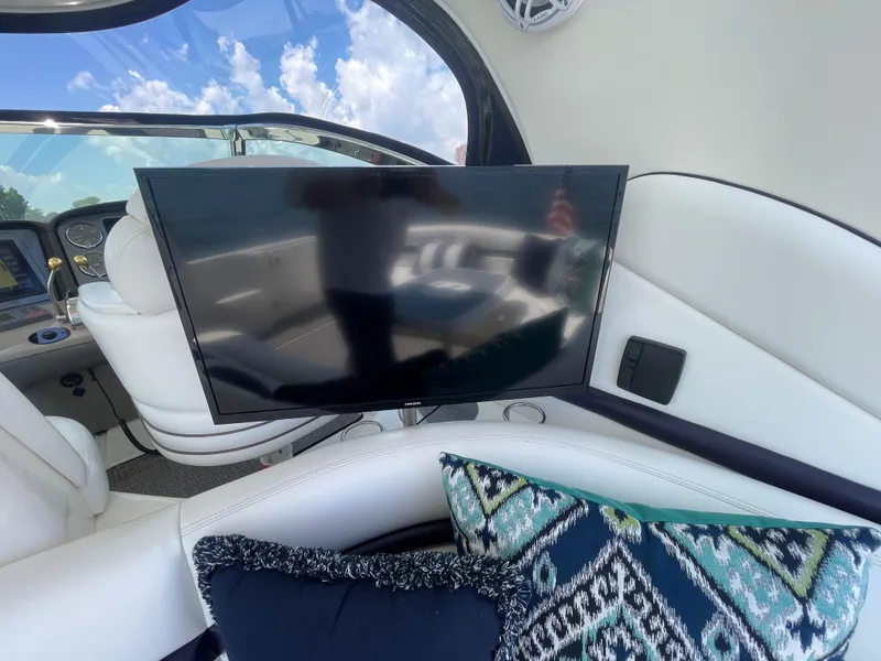 Slide: The Image of Interior of 2006 Sea Ray 44 Sundancer with TV and patterned cushions. - 26