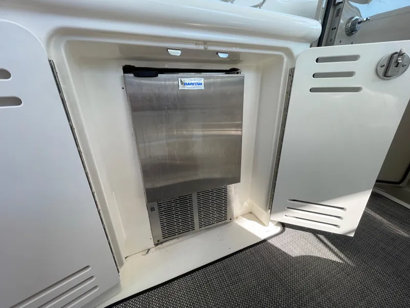 Slide: The Image of 2006 Sea Ray 44 Sundancer boat with built-in stainless steel refrigerator. - 28