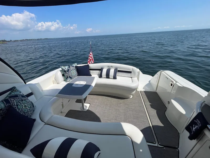 Slide: The Image of Luxurious 2006 Sea Ray 44 Sundancer yacht with elegant seating and ocean view. - 29
