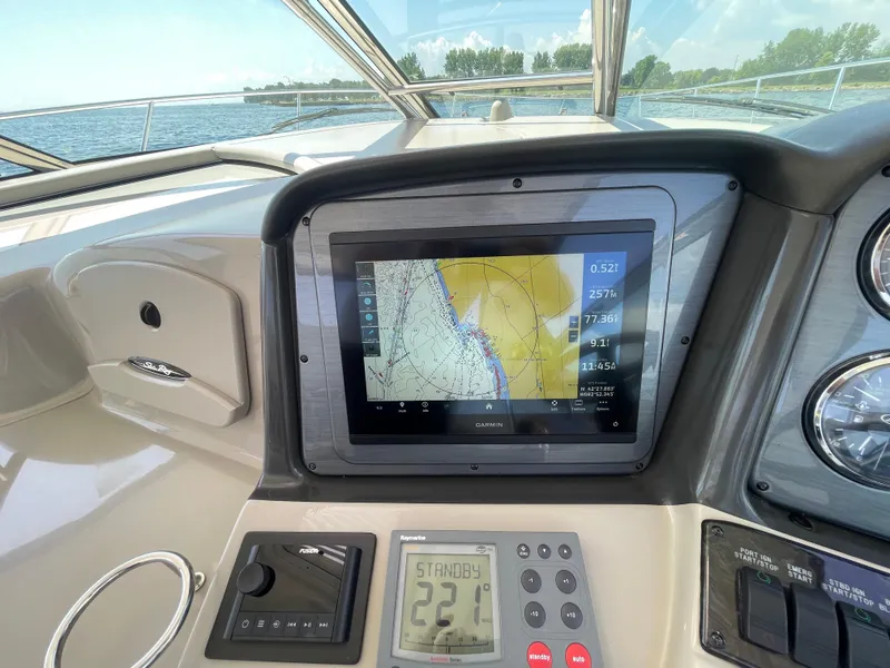Slide: The Image of 2006 Sea Ray 44 Sundancer helm with Garmin navigation display and control panel. - 35