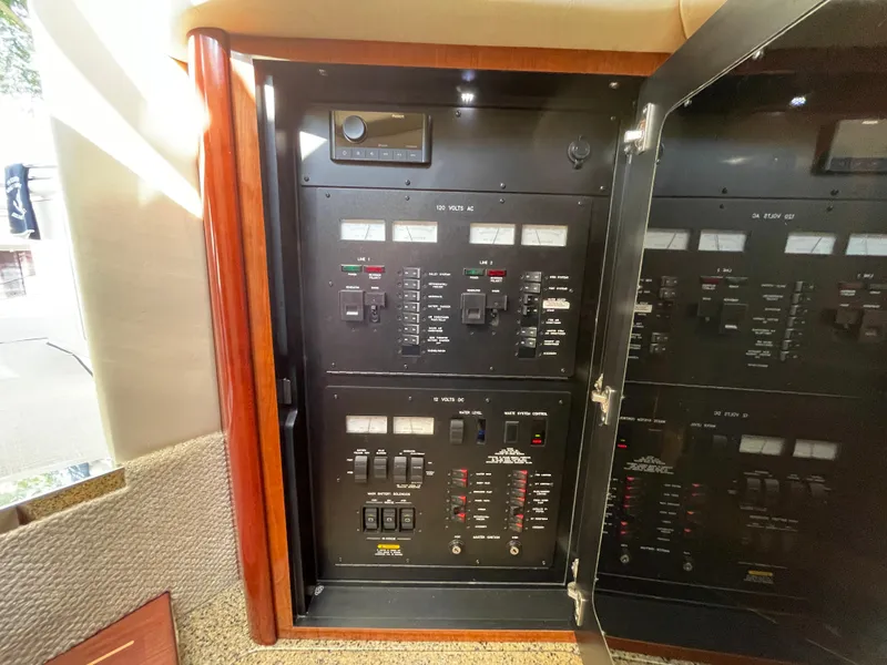 Slide: The Image of Electrical control panel inside a 2006 Sea Ray 44 Sundancer yacht. - 44