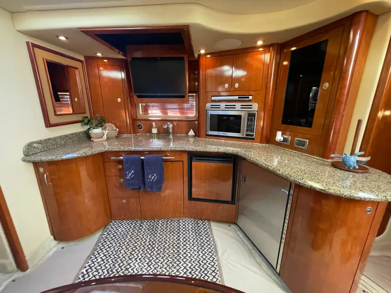 Slide: The Image of Luxurious kitchen interior of 2006 Sea Ray 44 Sundancer yacht with modern appliances. - 45