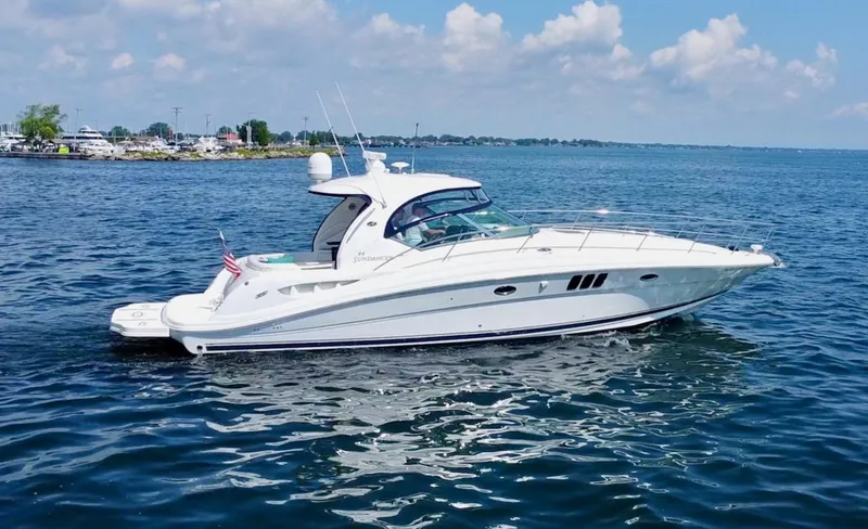 Slide: The Image of 2006 Sea Ray 44 Sundancer yacht cruising on a sunny day with clear blue skies. - 7