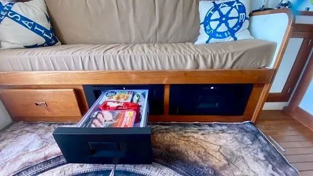 Slide: The Image of Interior of 1987 Roughwater 37 boat with storage drawers and nautical-themed decor. - 15