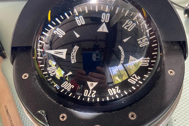 Slide: The Image of Close-up of a Ritchie compass on a 1987 Roughwater 37 boat. - 19