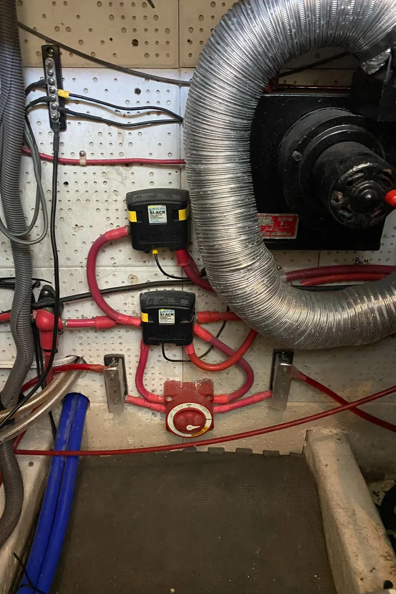 Slide: The Image of Engine room of a 1987 Roughwater 37 boat with wiring and ventilation. - 23