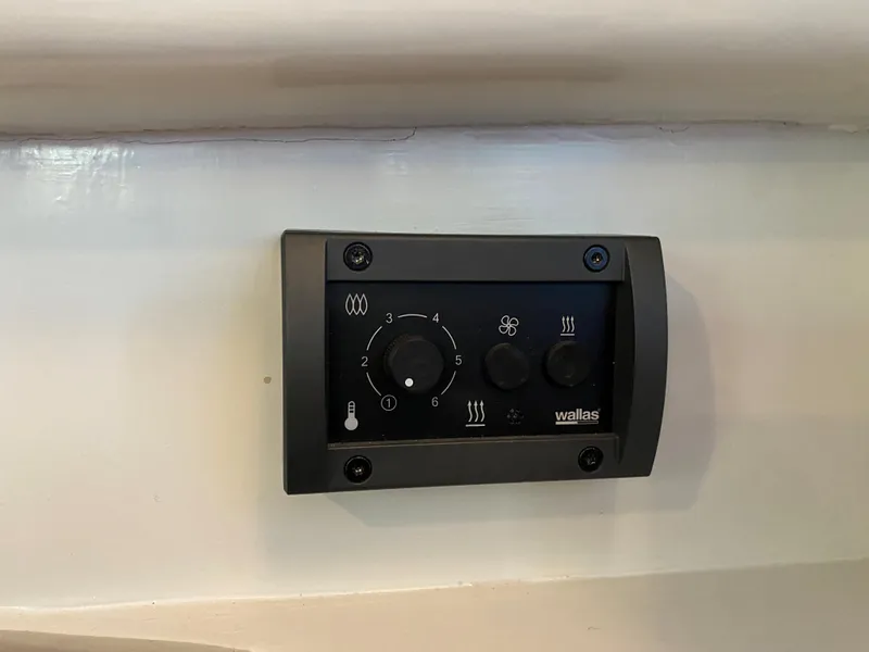 Slide: The Image of Control panel on 1987 Roughwater 37 boat, featuring Wallas heater settings. - 27