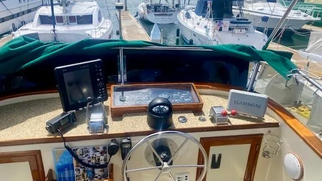 Slide: The Image of Cockpit of 1987 Roughwater 37 boat with navigation equipment and steering wheel. - 4