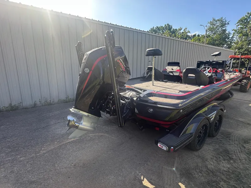 Slide: The Image of 2024 Nitro Z21XL boat with powerful outboard motor, parked outdoors in sunlight. - 5