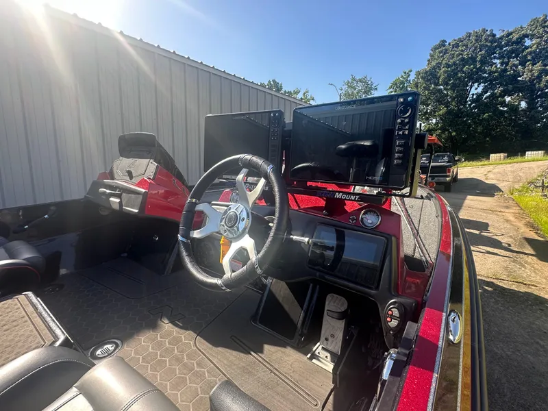 Slide: The Image of 2024 Nitro Z21XL boat cockpit with steering wheel and electronic displays. - 8