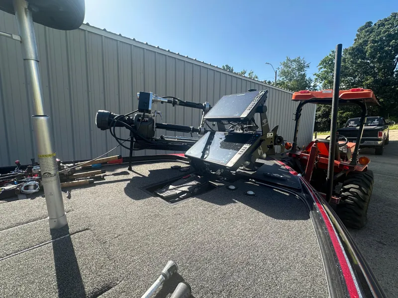 Slide: The Image of 2024 Nitro Z21XL boat with advanced electronics and equipment, parked near a metal building. - 9