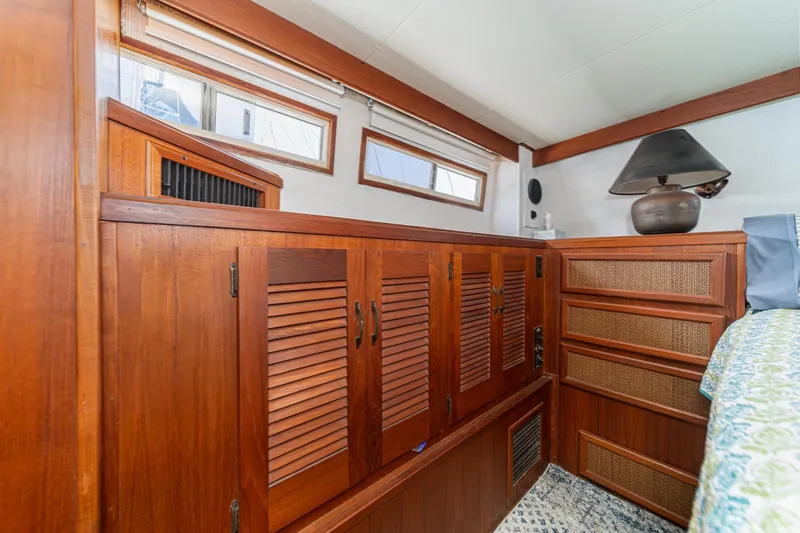 Slide: The Image of Interior of 1982 Viking 44 Motor Yacht with wooden cabinetry and decorative lamp. - 13