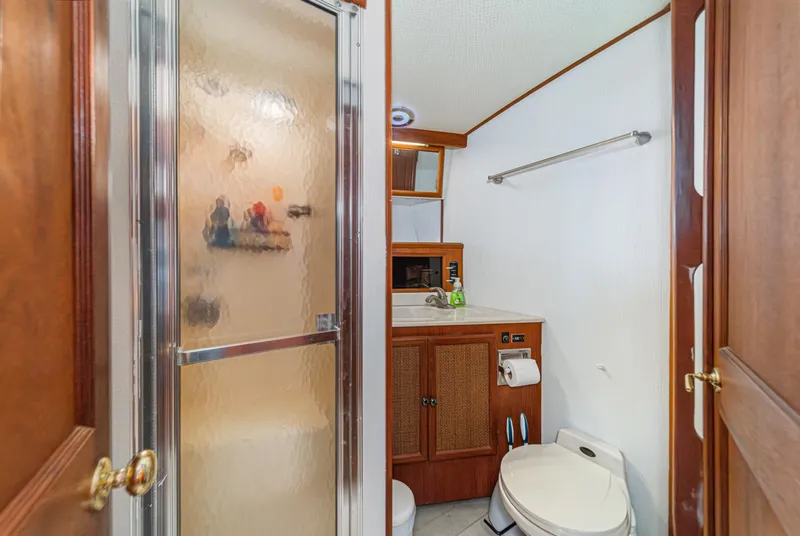 Slide: The Image of Bathroom interior of 1982 Viking 44 Motor Yacht with shower and vanity. - 16