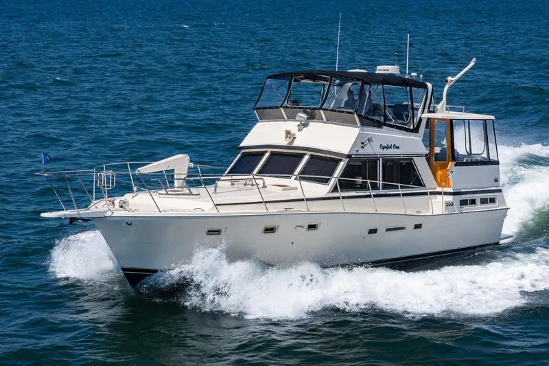 Slide: The Image of 1982 Viking 44 Motor Yacht cruising on open water. - 2