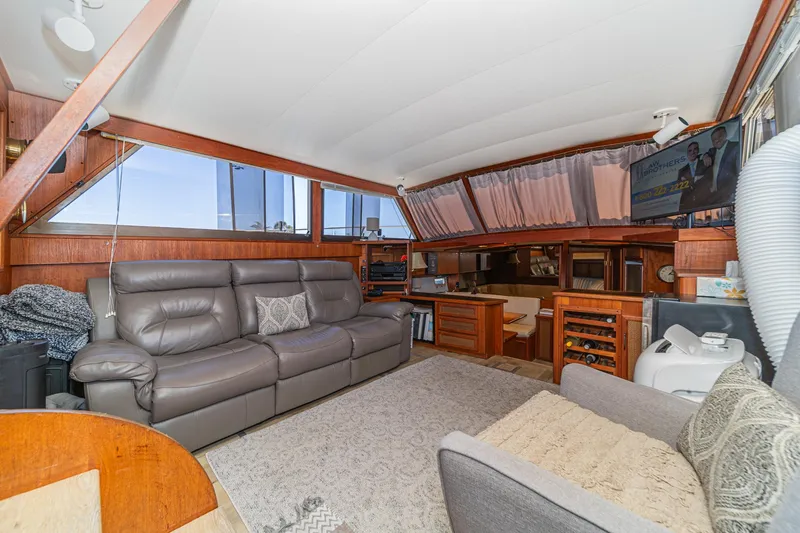 Slide: The Image of Interior of 1982 Viking 44 Motor Yacht with leather seating and wood accents. - 26