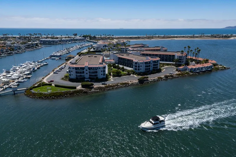 Slide: The Image of Aerial view of 1982 Viking 44 Motor Yacht cruising near coastal marina. - 31