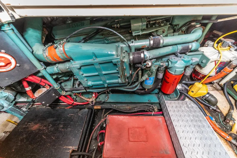 Slide: The Image of Engine room of 1982 Viking 44 Motor Yacht with visible components and wiring. - 9