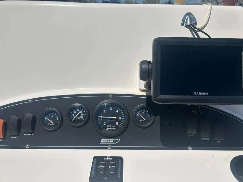 Slide: The Image of Dashboard of a 2004 Boston Whaler 190 Nantucket with Garmin GPS and gauges. - 11