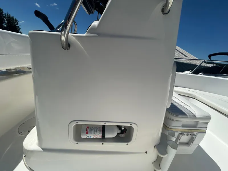 Slide: The Image of 2004 Boston Whaler 190 Nantucket boat interior with fire extinguisher compartment. - 16