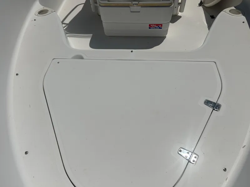 Slide: The Image of 2004 Boston Whaler 190 Nantucket boat deck with storage compartment and cooler. - 21