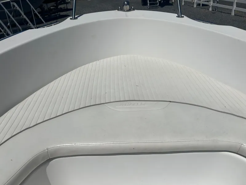 Slide: The Image of 2004 Boston Whaler 190 Nantucket boat interior with white seating and deck. - 22