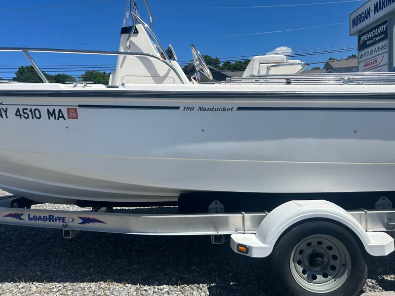 Slide: The Image of 2004 Boston Whaler 190 Nantucket boat on trailer, side view. - 5