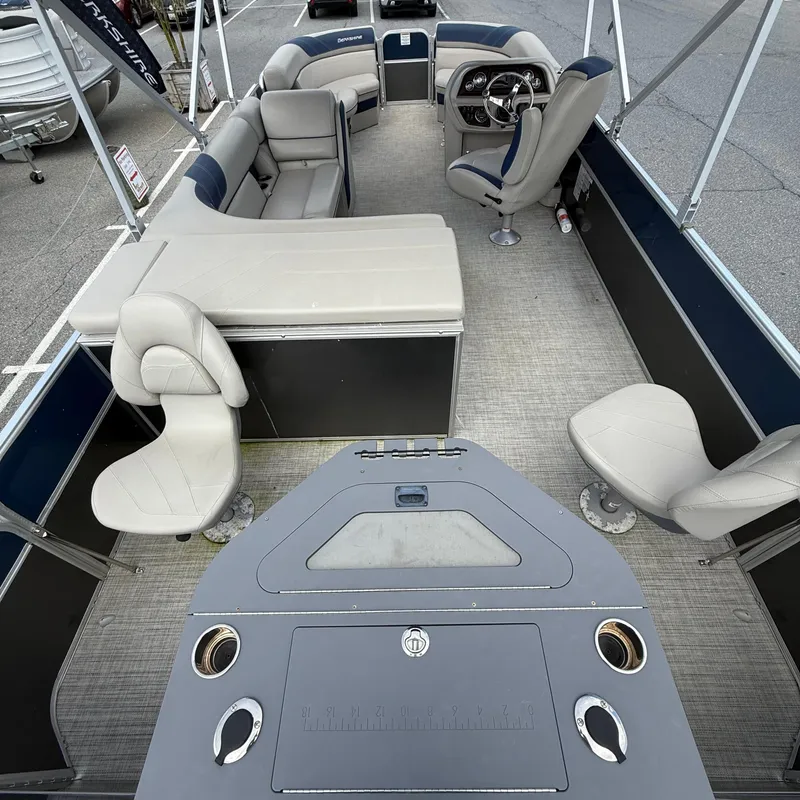 Slide: The Image of 2022 Berkshire 24RFC LE 2.75 pontoon boat interior with seating and helm. - 11