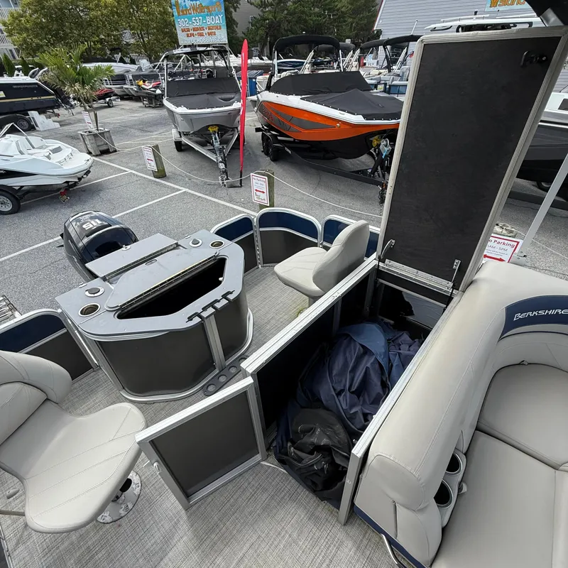 Slide: The Image of 2022 Berkshire 24RFC LE 2.75 pontoon boat interior at a boat show. - 12