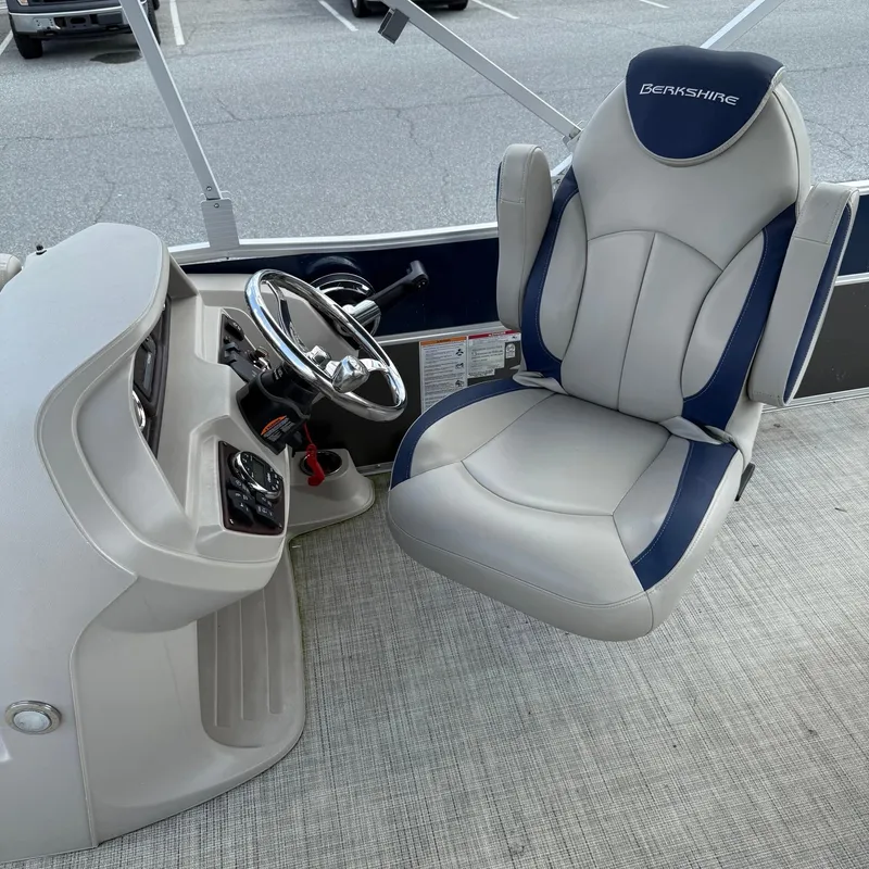 Slide: The Image of Captain's chair and helm of 2022 Berkshire 24RFC LE 2.75 pontoon boat. - 13