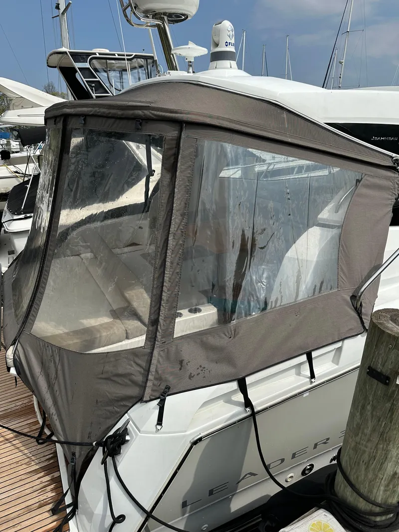 Slide: The Image of 2016 Jeanneau Leader 36 with cockpit enclosure at marina. - 11