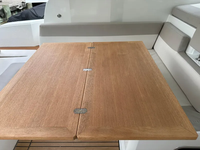 Slide: The Image of Wooden table on the deck of a 2016 Jeanneau Leader 36 boat. - 22