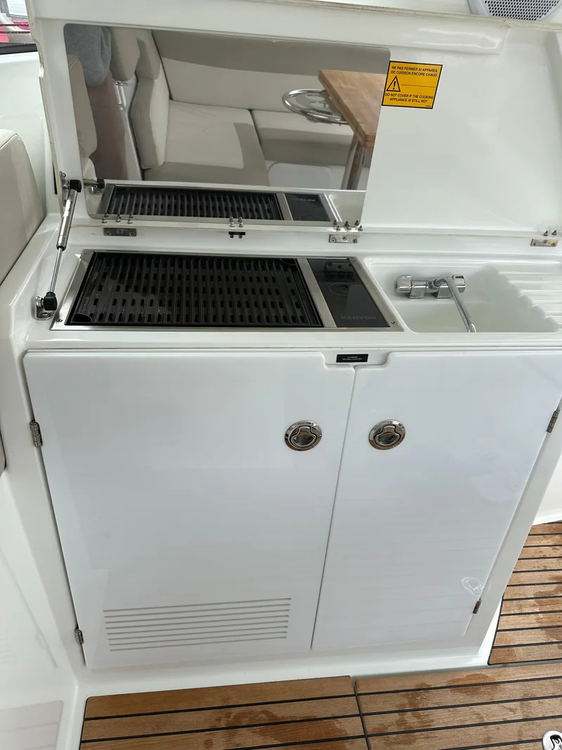 Slide: The Image of Outdoor kitchenette on a 2016 Jeanneau Leader 36 yacht with grill and sink. - 27