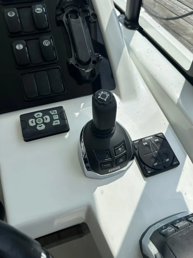 Slide: The Image of Joystick control panel of a 2016 Jeanneau Leader 36 boat. - 34