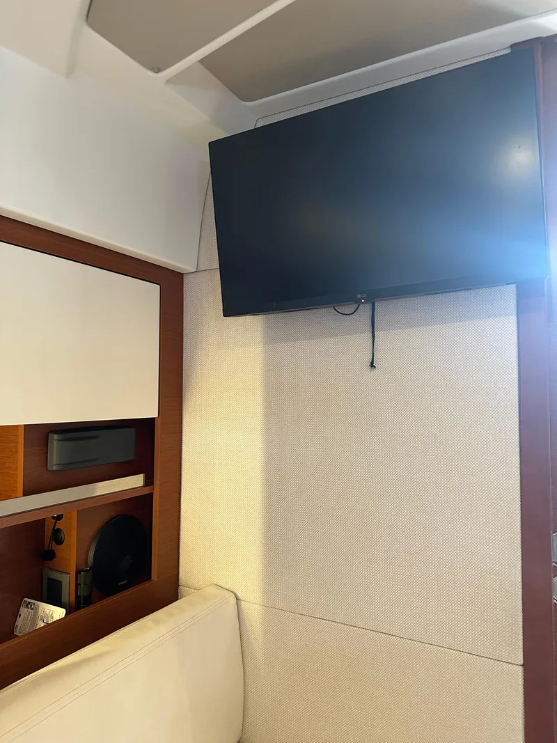 Slide: The Image of Flat-screen TV in the cabin of a 2016 Jeanneau Leader 36 yacht. - 38