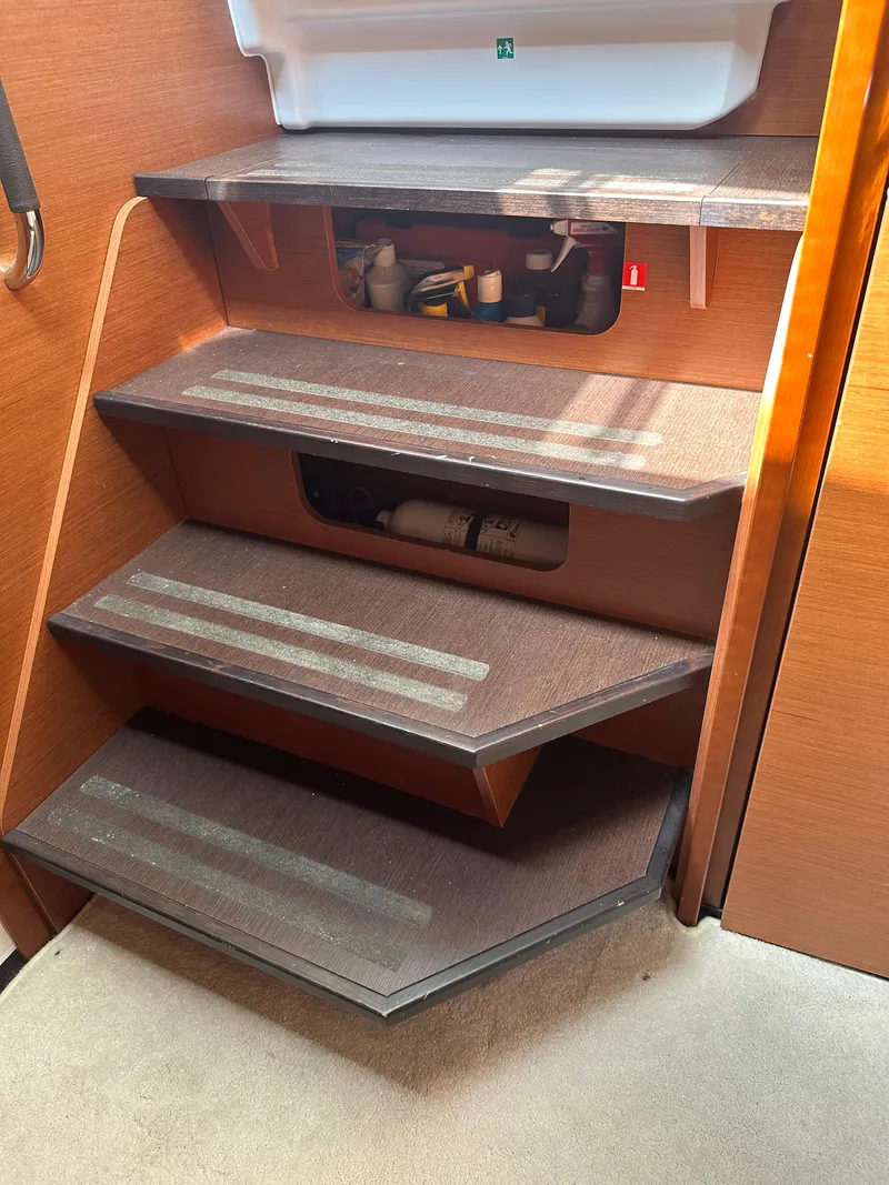Slide: The Image of Staircase inside 2016 Jeanneau Leader 36 boat with storage compartments. - 46