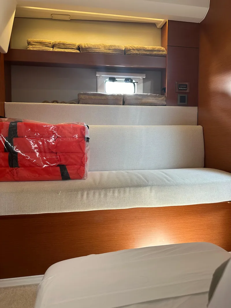 Slide: The Image of Interior cabin of 2016 Jeanneau Leader 36 with seating and storage. - 52