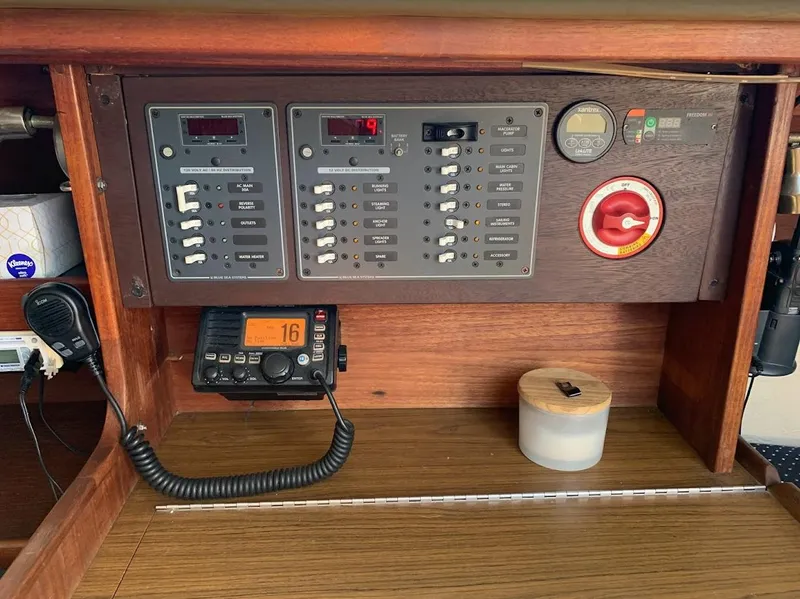 Slide: The Image of Electrical control panel on a 1984 Catalina 38 sailboat with radio and switches. - 34
