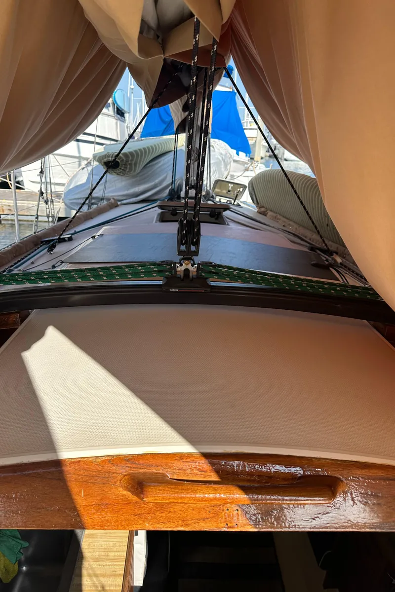 Slide: The Image of 1984 Catalina 38 sailboat deck with sails and rigging in marina. - 7