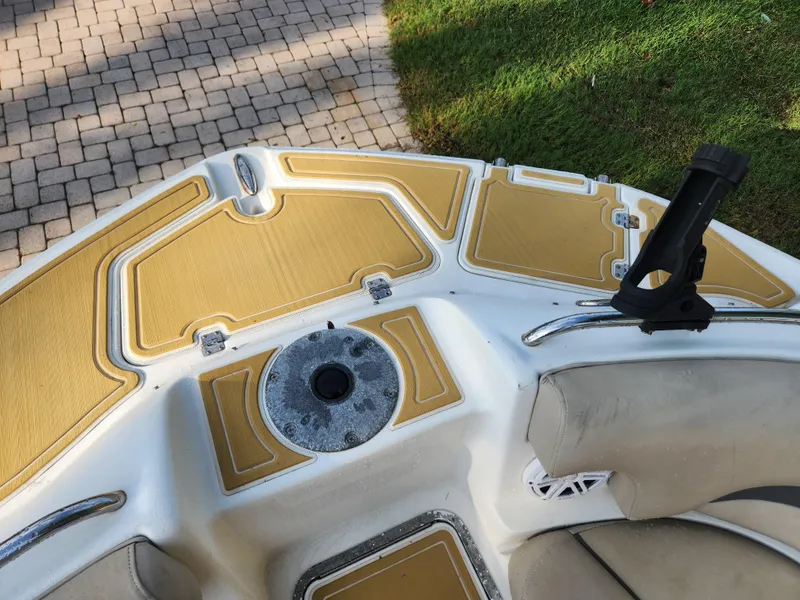 Slide: The Image of 2013 Hurricane SD2400 OB boat deck with rod holder and seating. - 13