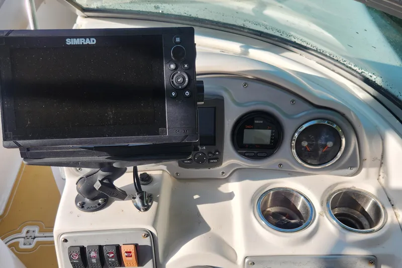 Slide: The Image of Dashboard of a 2013 Hurricane SD2400 OB boat with Simrad display and gauges. - 7