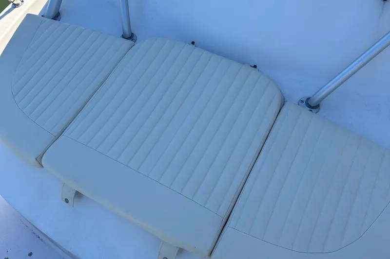 Slide: The Image of 2004 Grady-White Sailfish 282 WA boat seat, white upholstery, ribbed design. - 11