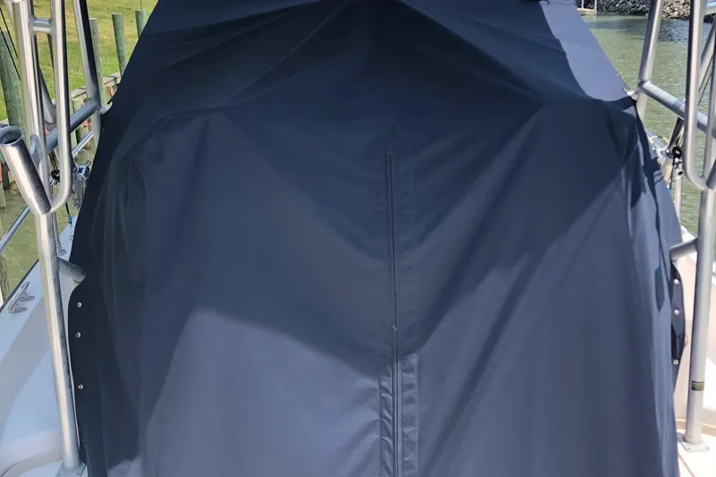 Slide: The Image of 2004 Grady-White Sailfish 282 WA boat with protective cover on deck. - 17